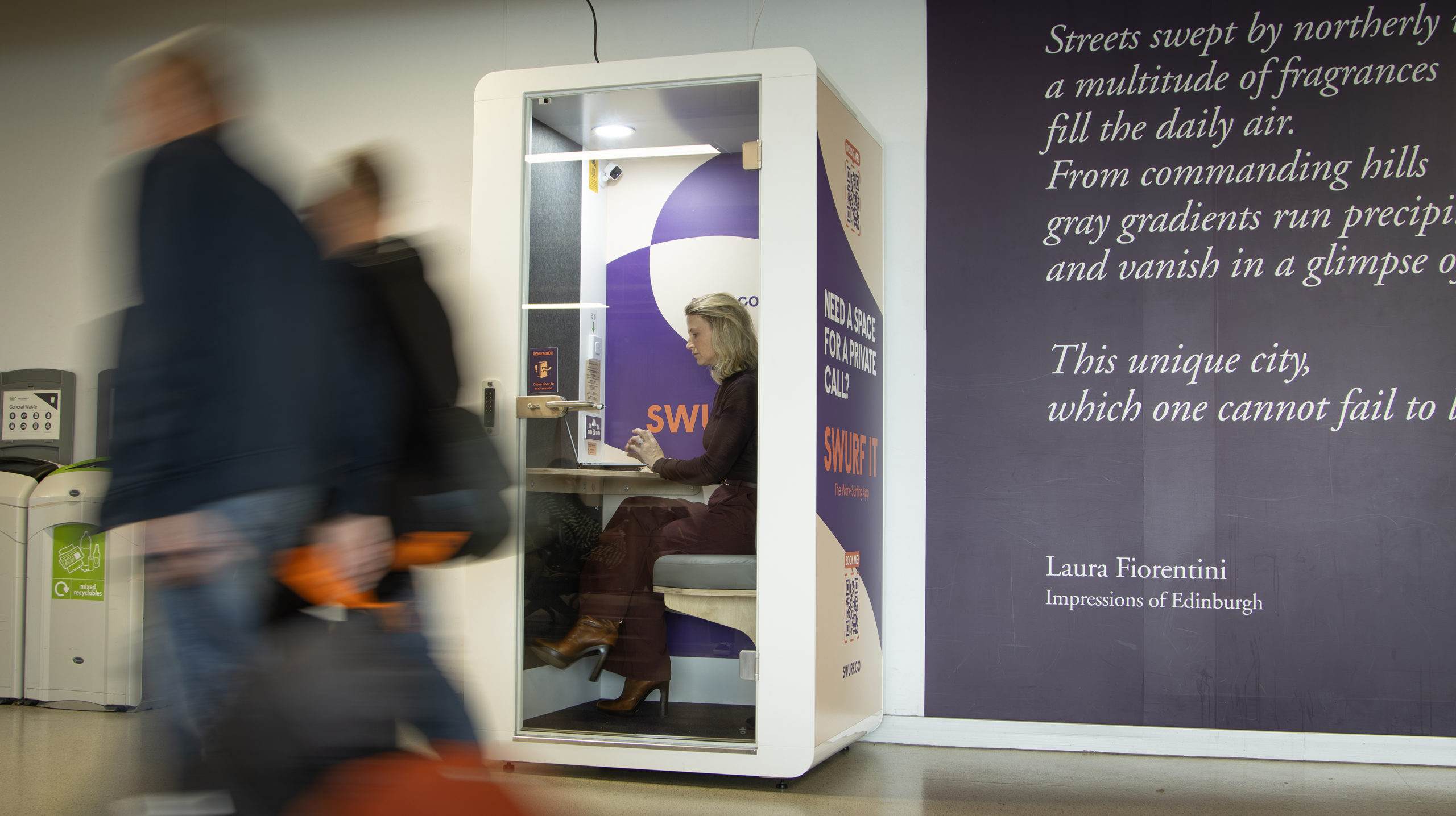 A business traveller using a SWURF Pod at Edinburgh Airport